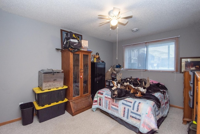 1810 41st Ave S, Moorhead, MN 56560 - carpeted bedroom featuring a textured ceiling, a ceiling fan, and baseboards