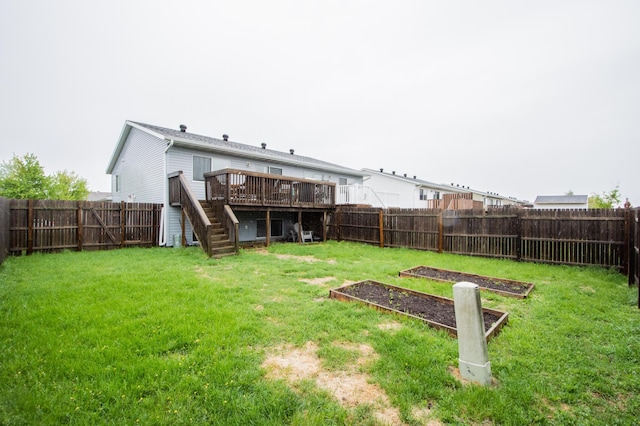 1810 41st Ave S, Moorhead, MN 56560 - view of yard with stairs, a garden, and a deck