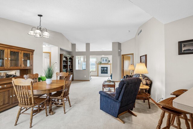12 3rd St NW, Saint Michael, MN 55376 - dining space featuring vaulted ceiling, light carpet, and a chandelier