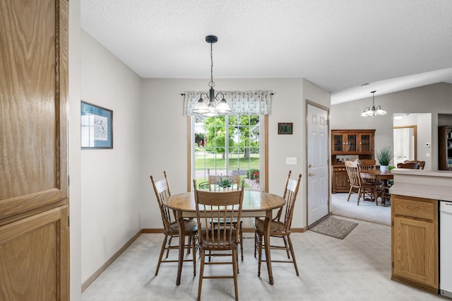 12 3rd St NW, Saint Michael, MN 55376 - dining room with a chandelier, vaulted ceiling, a textured ceiling, and light colored carpet