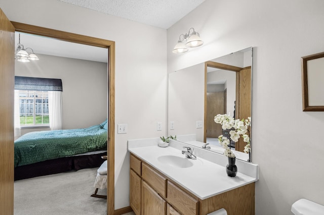 12 3rd St NW, Saint Michael, MN 55376 - ensuite bathroom with vanity and a textured ceiling