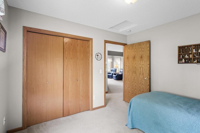 12 3rd St NW, Saint Michael, MN 55376 - bedroom featuring light carpet and a closet