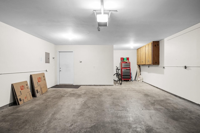 12 3rd St NW, Saint Michael, MN 55376 - garage featuring a garage door opener and electric panel