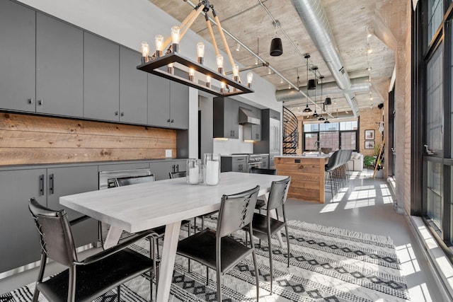 525 3rd St N Unit 511, Minneapolis, MN 55401 - dining space featuring a high ceiling, concrete floors, and a chandelier