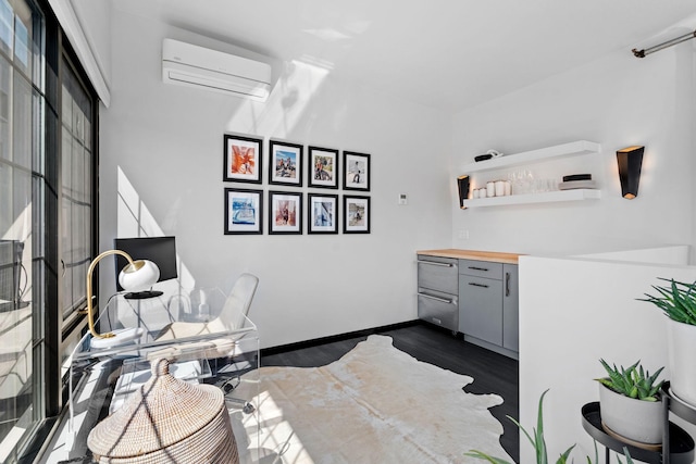 525 3rd St N Unit 511, Minneapolis, MN 55401 - office area featuring an AC wall unit and dark wood finished floors