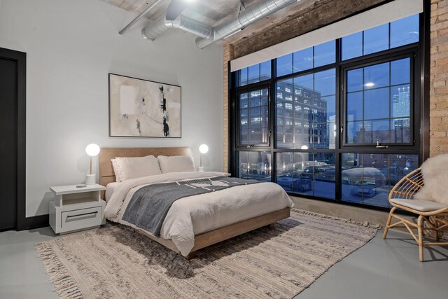 525 3rd St N Unit 511, Minneapolis, MN 55401 - bedroom featuring concrete flooring, a towering ceiling, and a view of city