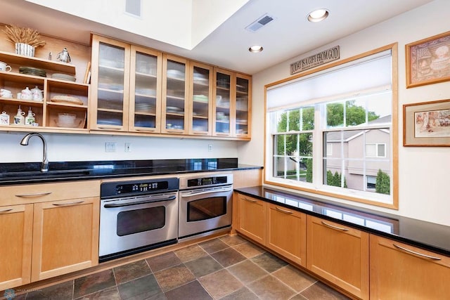 404 8th St S Unit 303, Fargo, ND 58103 - kitchen with stainless steel oven, a sink, dark countertops, and recessed lighting