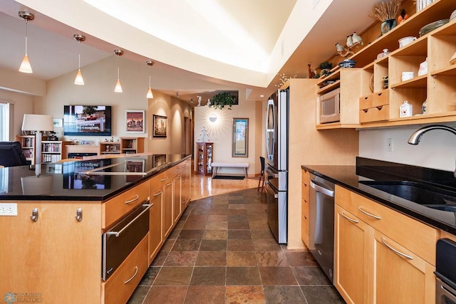 404 8th St S Unit 303, Fargo, ND 58103 - kitchen with a sink, a warming drawer, stainless steel appliances, dark countertops, and stone tile floors