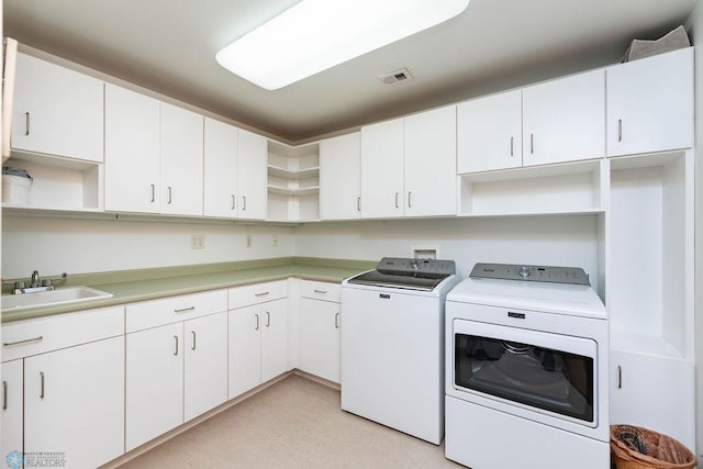 404 8th St S Unit 303, Fargo, ND 58103 - washroom featuring washer and clothes dryer and cabinet space