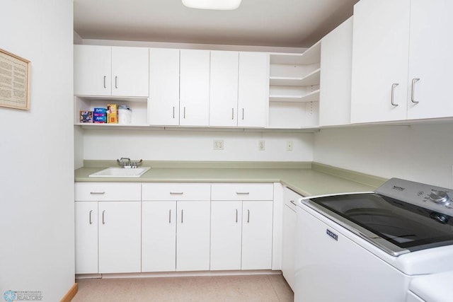 404 8th St S Unit 303, Fargo, ND 58103 - laundry room with cabinet space and washer and clothes dryer