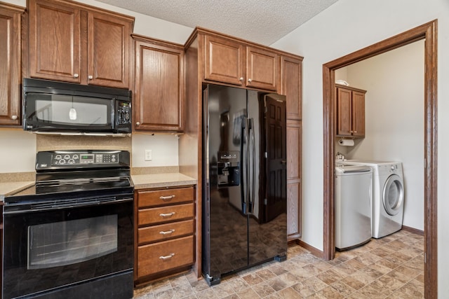 6665 Flycatcher Ln, Apple Valley, MN 55124 - kitchen featuring black appliances, washing machine and clothes dryer, light countertops, brown cabinetry, and a textured ceiling