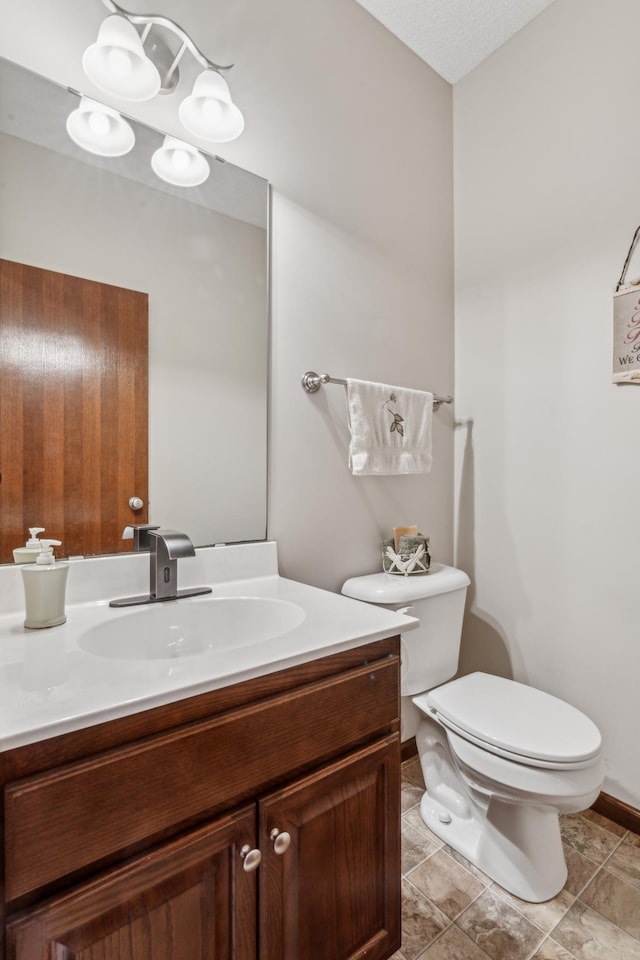 6665 Flycatcher Ln, Apple Valley, MN 55124 - bathroom with vanity, toilet, and baseboards