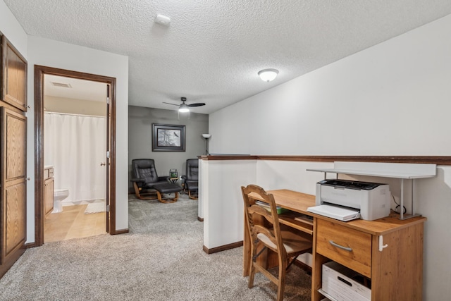 6665 Flycatcher Ln, Apple Valley, MN 55124 - office with light colored carpet, a ceiling fan, baseboards, and a textured ceiling