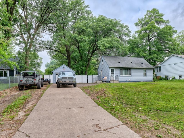 7338 Silver Lake Rd, Mounds View, MN 55112 - view of home's exterior with concrete driveway and a shingled roof