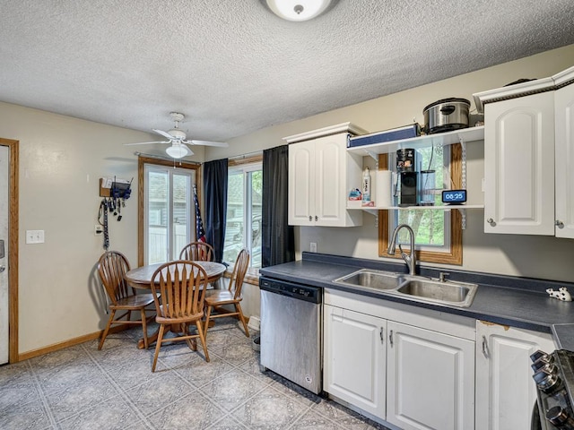 7338 Silver Lake Rd, Mounds View, MN 55112 - kitchen featuring stainless steel appliances, dark countertops, white cabinetry, a textured ceiling, and ceiling fan