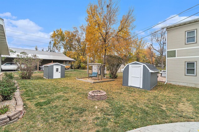 506 8th Ave SW, Pipestone, MN 56164 - view of green lawn with an outdoor fire pit