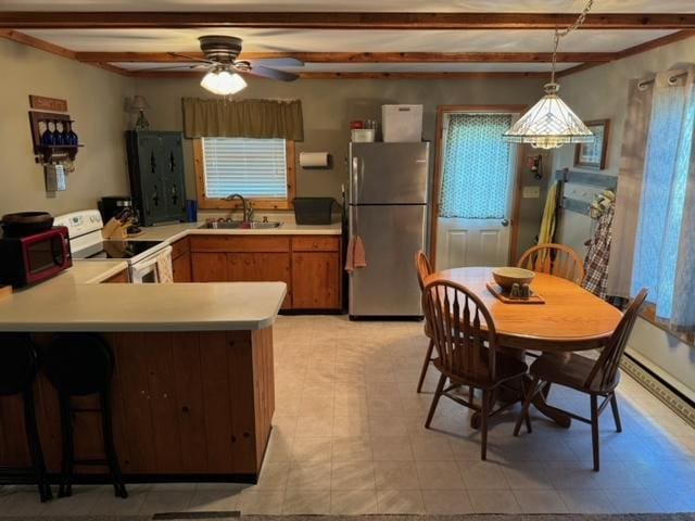 48408 Pillar Rd, Deer River, MN 56631 - kitchen with freestanding refrigerator, white range with electric cooktop, a sink, beam ceiling, and a ceiling fan