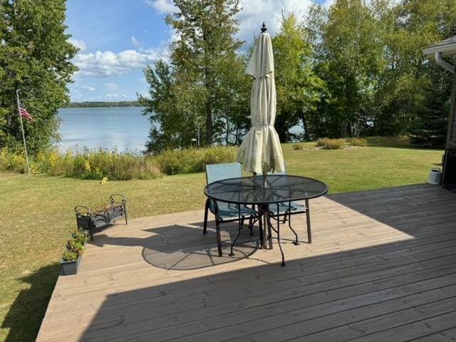 48408 Pillar Rd, Deer River, MN 56631 - deck featuring a water view, a lawn, and outdoor dining area