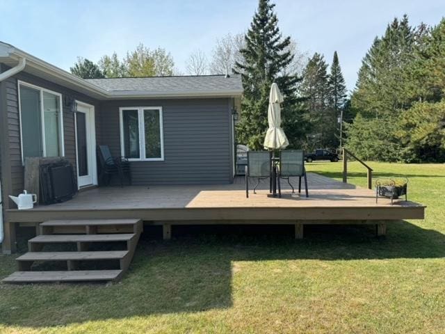 48408 Pillar Rd, Deer River, MN 56631 - wooden deck featuring central AC unit and a lawn