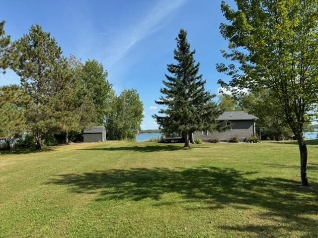 48408 Pillar Rd, Deer River, MN 56631 - view of green lawn featuring a water view