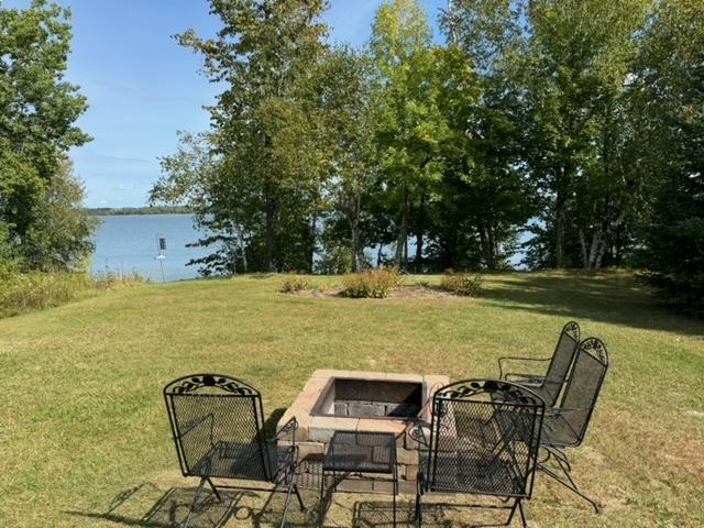 48408 Pillar Rd, Deer River, MN 56631 - view of grassy yard featuring an outdoor fire pit