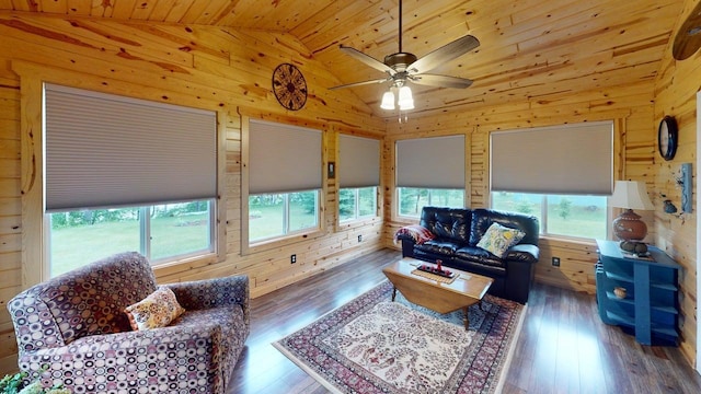 48408 Pillar Rd, Deer River, MN 56631 - living room with lofted ceiling, wood ceiling, wooden walls, wood-type flooring, and ceiling fan