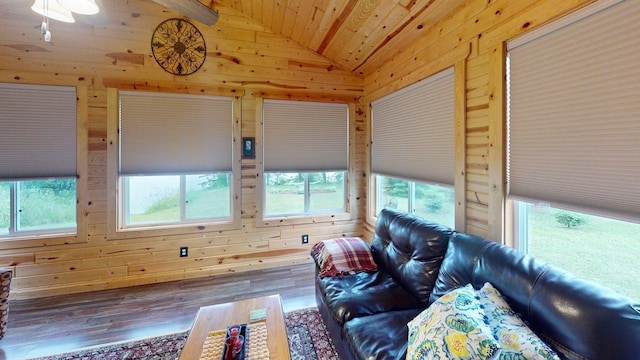 48408 Pillar Rd, Deer River, MN 56631 - living room with lofted ceiling, wood walls, wood finished floors, and wood ceiling