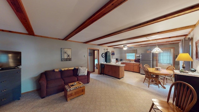 48408 Pillar Rd, Deer River, MN 56631 - living area featuring beam ceiling, light carpet, and a ceiling fan