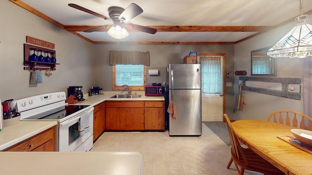 48408 Pillar Rd, Deer River, MN 56631 - kitchen featuring freestanding refrigerator, white electric range oven, ceiling fan, brown cabinets, and light countertops