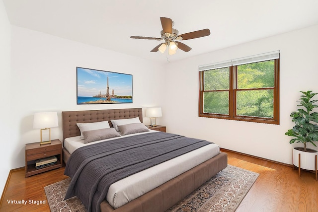 4248 Westview Dr, Shoreview, MN 55126 - bedroom featuring wood finished floors and a ceiling fan
