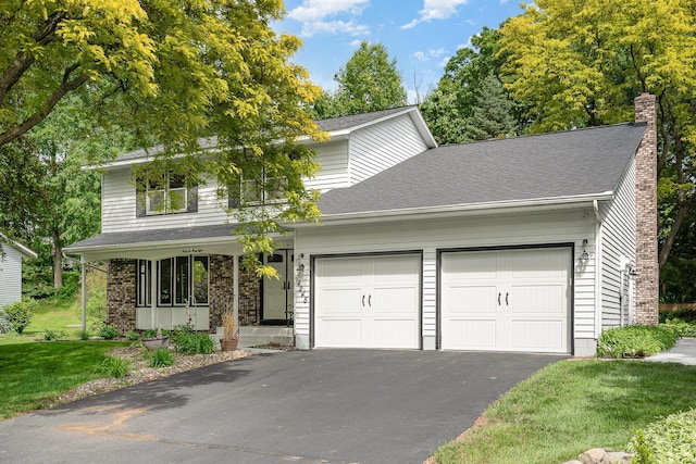 4248 Westview Dr, Shoreview, MN 55126 - traditional-style home featuring a garage, asphalt driveway, a chimney, a front lawn, and a shingled roof