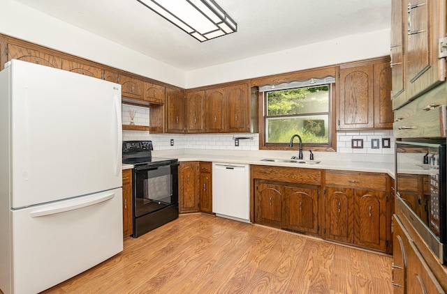 4248 Westview Dr, Shoreview, MN 55126 - kitchen featuring white appliances, a sink, light countertops, and tasteful backsplash