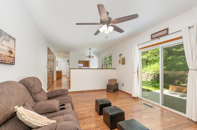4248 Westview Dr, Shoreview, MN 55126 - living area with wood finished floors, ceiling fan, a chandelier, and baseboards