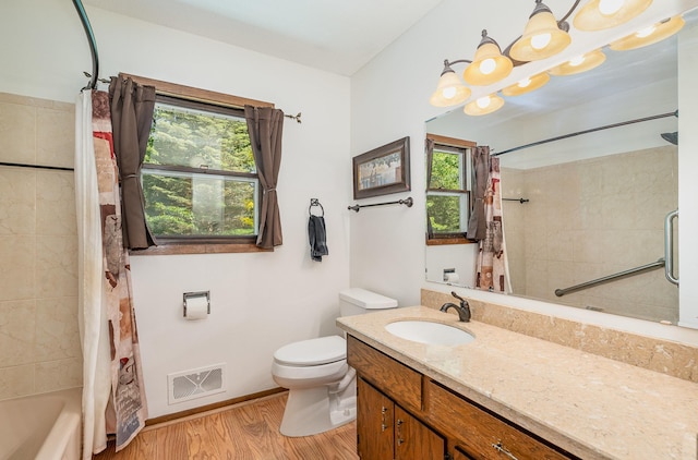 4248 Westview Dr, Shoreview, MN 55126 - bathroom featuring plenty of natural light, wood finished floors, toilet, and vanity