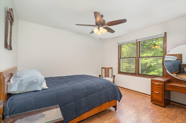 4248 Westview Dr, Shoreview, MN 55126 - bedroom with light wood-style flooring and a ceiling fan