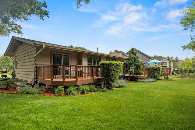 2725 Pilgrim Ln N, Plymouth, MN 55441 - rear view of house with a wooden deck and a lawn