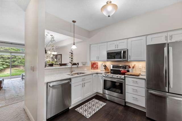 2244 Water Lilly Ln Unit 405, Eagan, MN 55122 - kitchen with stainless steel appliances, a sink, white cabinets, backsplash, and light stone countertops