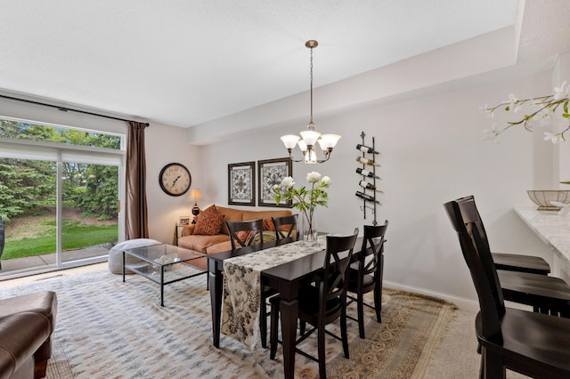 2244 Water Lilly Ln Unit 405, Eagan, MN 55122 - dining area featuring a chandelier and baseboards