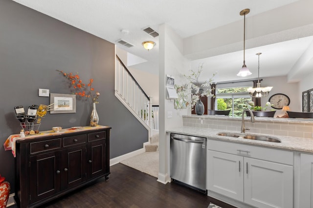 2244 Water Lilly Ln Unit 405, Eagan, MN 55122 - kitchen featuring dishwasher, a sink, dark wood-style flooring, tasteful backsplash, and light stone countertops