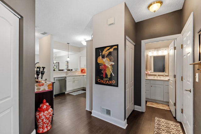 2244 Water Lilly Ln Unit 405, Eagan, MN 55122 - corridor with a sink, dark wood-type flooring, and baseboards