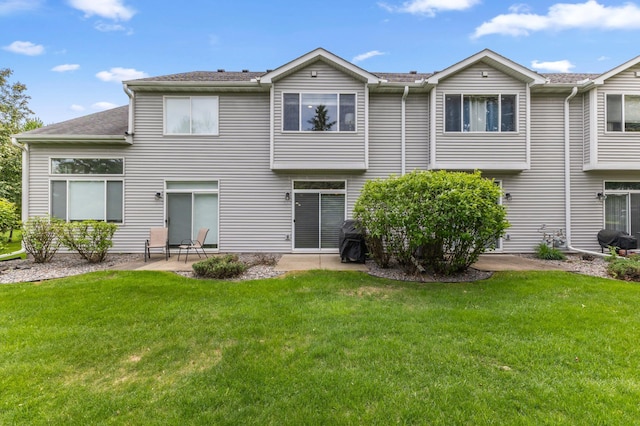 2244 Water Lilly Ln Unit 405, Eagan, MN 55122 - back of house with a patio and a yard
