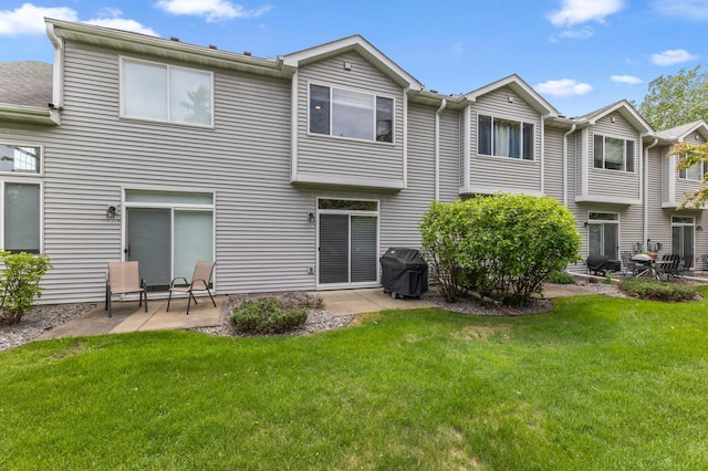 2244 Water Lilly Ln Unit 405, Eagan, MN 55122 - rear view of house with a patio area and a yard