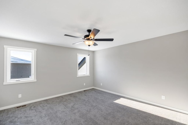 7773 Gunner Dr, Clear Lake, MN 55319 - unfurnished room featuring ceiling fan, baseboards, and carpet flooring