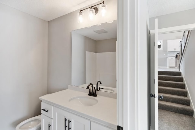 7773 Gunner Dr, Clear Lake, MN 55319 - full bathroom with toilet, vanity, and a textured ceiling