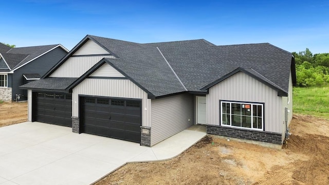 7773 Gunner Dr, Clear Lake, MN 55319 - modern inspired farmhouse featuring a garage, a shingled roof, concrete driveway, stone siding, and board and batten siding