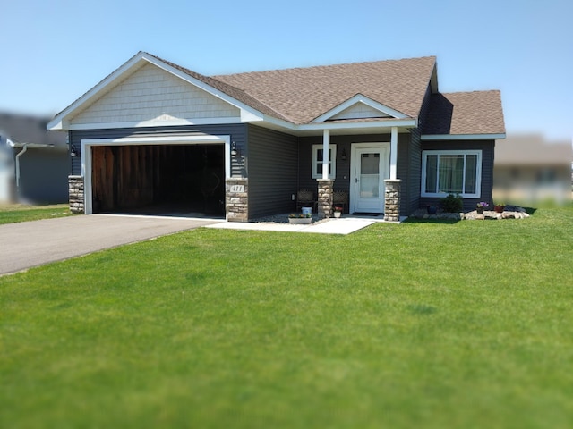 411 Ladd Ln, Osceola, WI 54020 - craftsman-style home featuring an attached garage, asphalt driveway, a front yard, roof with shingles, and stone siding