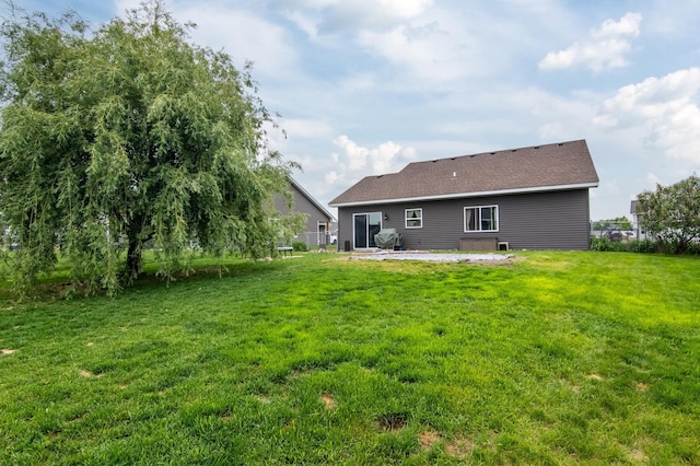 411 Ladd Ln, Osceola, WI 54020 - back of house featuring a patio and a yard