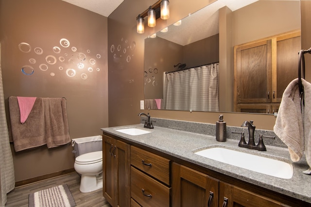 411 Ladd Ln, Osceola, WI 54020 - full bath featuring double vanity, wood finished floors, and curtained shower