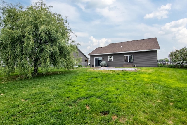 411 Ladd Ln, Osceola, WI 54020 - back of house featuring a patio area and a yard