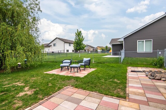 411 Ladd Ln, Osceola, WI 54020 - fenced backyard featuring a patio area and a residential view